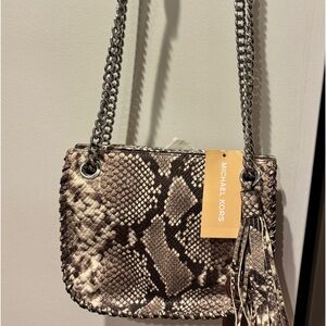 Michael Kors small messenger adjustable straps purse.